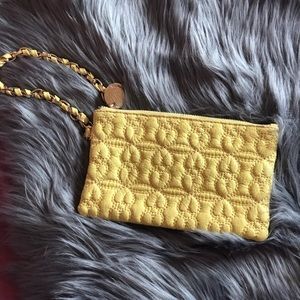 Deuce Lux clutch yellow with teal lining.